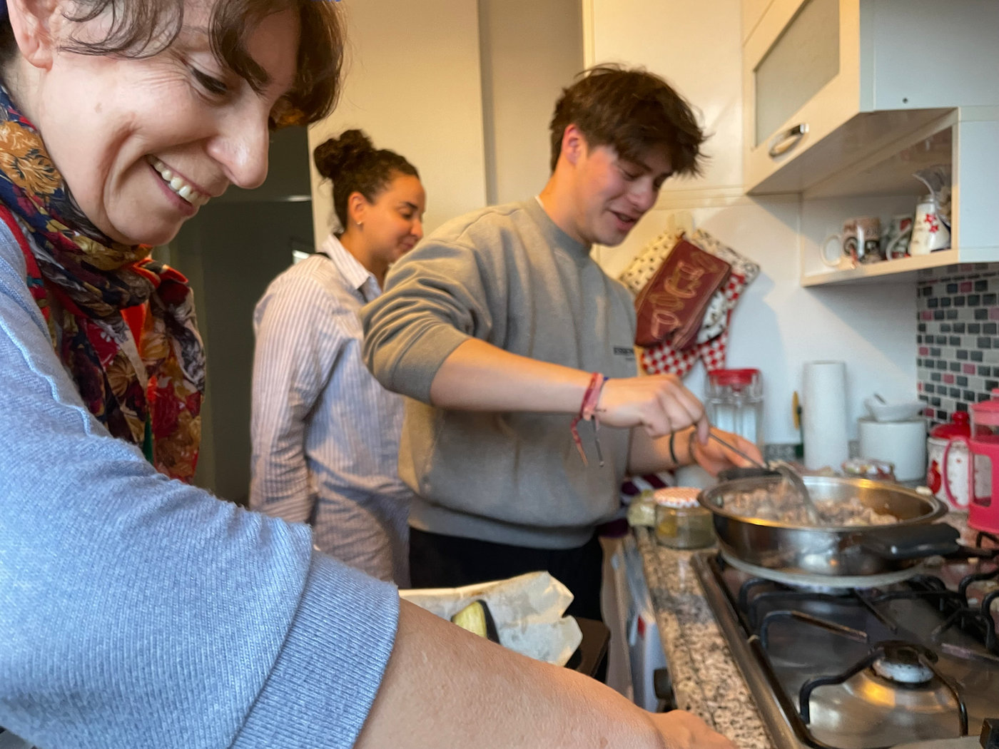 Guests cooking together in a LokalBond host’s home
